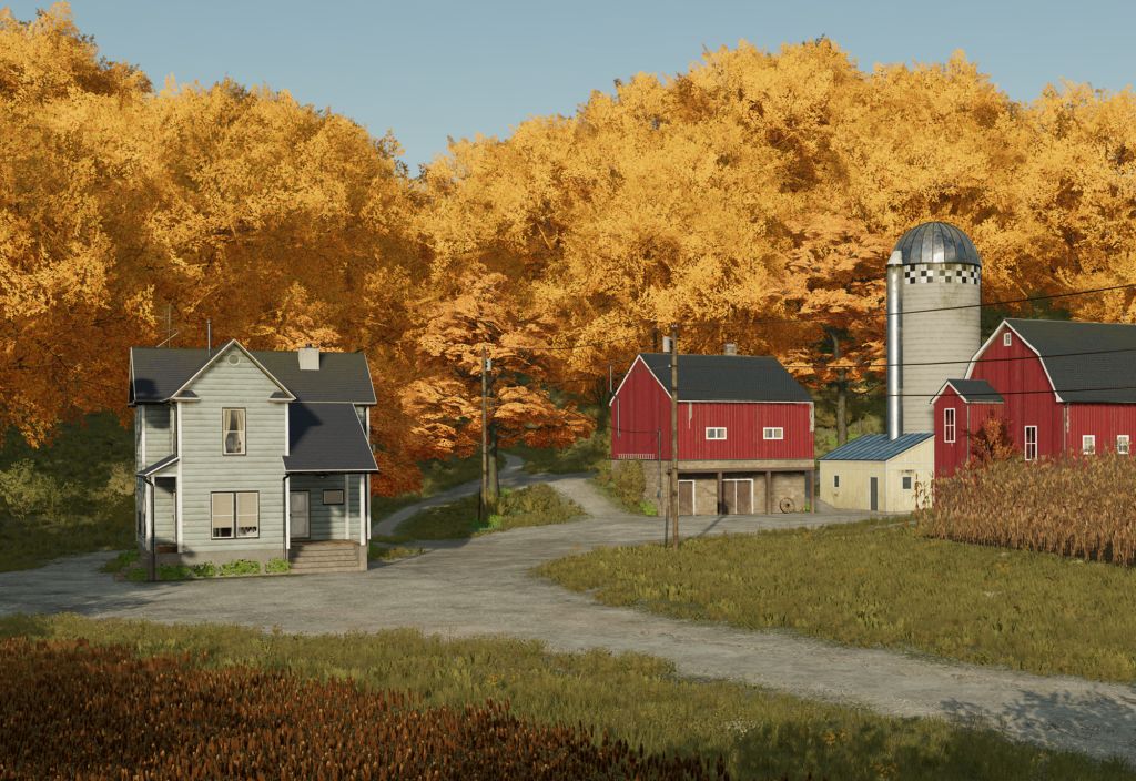 Wohnhaus neben Roter Farm vor Wald mit goldenen Bäumen