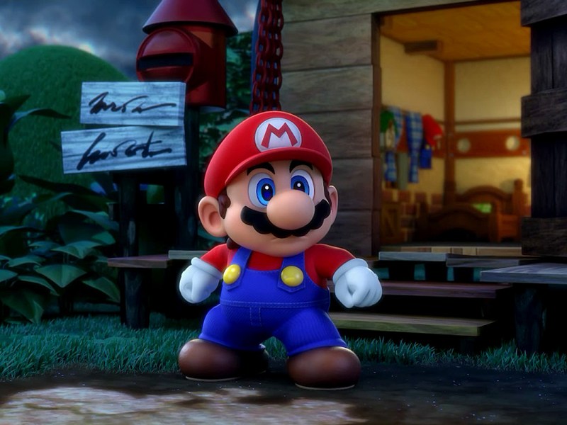 Screenshot aus dem Videospiel Super Mario RPG. Man sieht den Helden Mario, wie er vor einer Hütte steht.