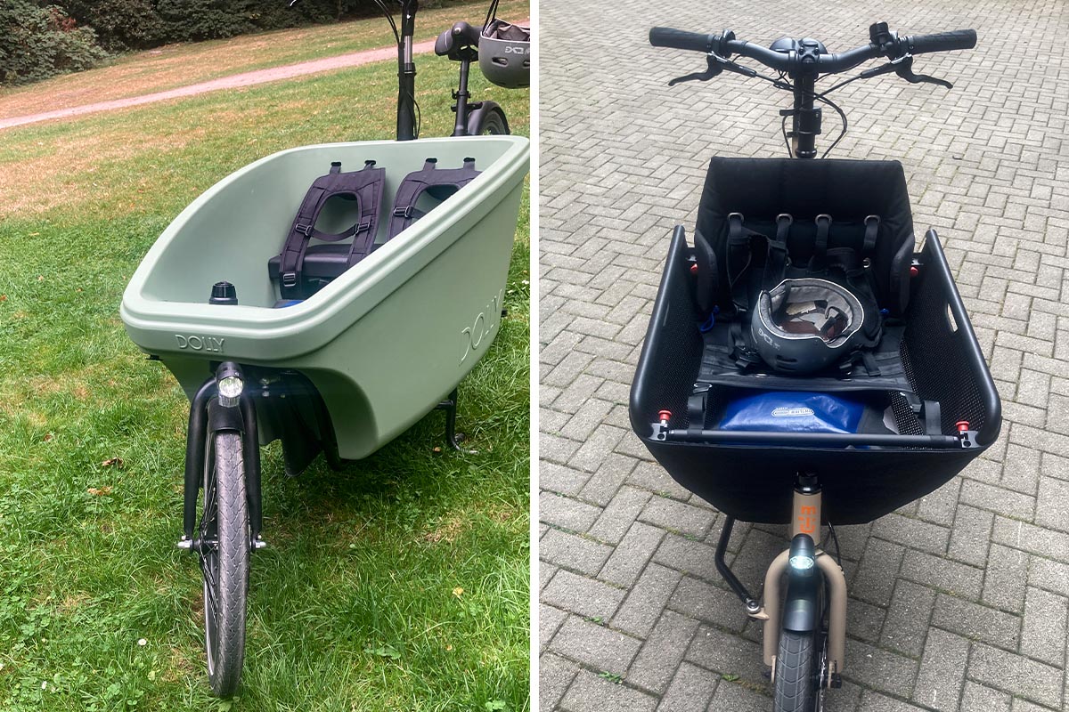 Cargo-E-Bikes auf einer Wiese und Pflastersteinen stehend.